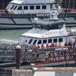 First Migrants Detained Under New UK-France Deal, But Legal Challenges Loom.